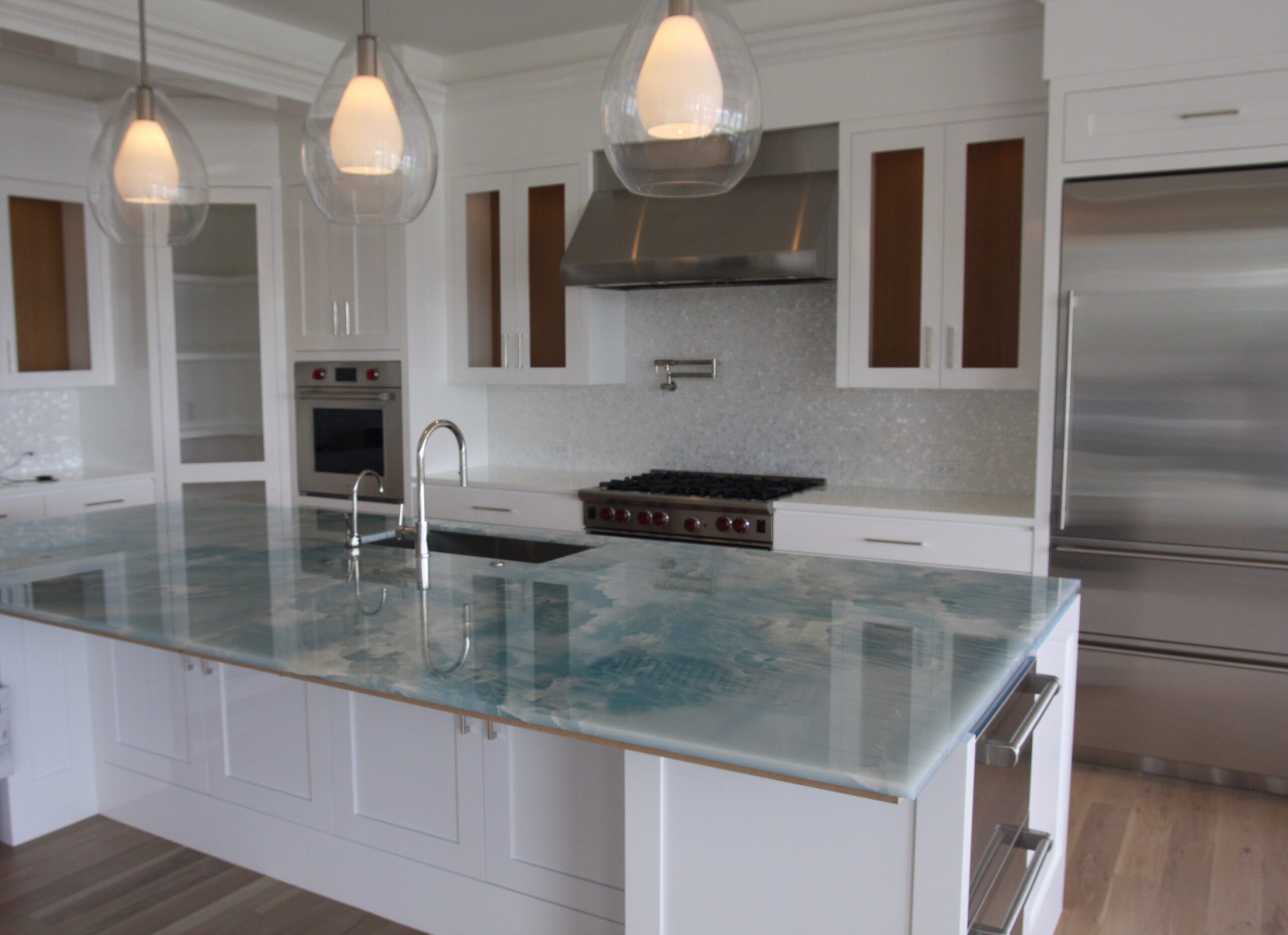 Blue Onyx Island top with Mother of Pearl Mosaic Backsplash