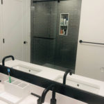 Shower Stall with Gray Gloss Subway and Glass Mosaic Floor Tile. White Quartz Countertop