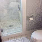 asian-cararra-marble-shower-with-large-hexagon-floor-tile