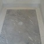 marble-slab-showerfloor-with-custom-gradation-starburst-pitch