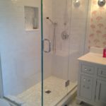 White Ceramic Subway with Mother of Pearl Shower Niche and Shower Floor