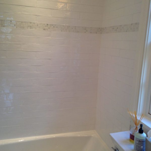 White Ceramic Subway with Mother of Pearl Shower Niche and Shower Floor