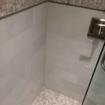 white-snow-field-tile-with-wood-vein-mosaic-border-and-showerfloor