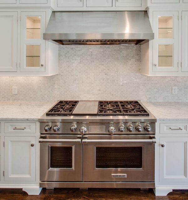 White Cararra Countertops with White Cararra Mosaic Backsplash